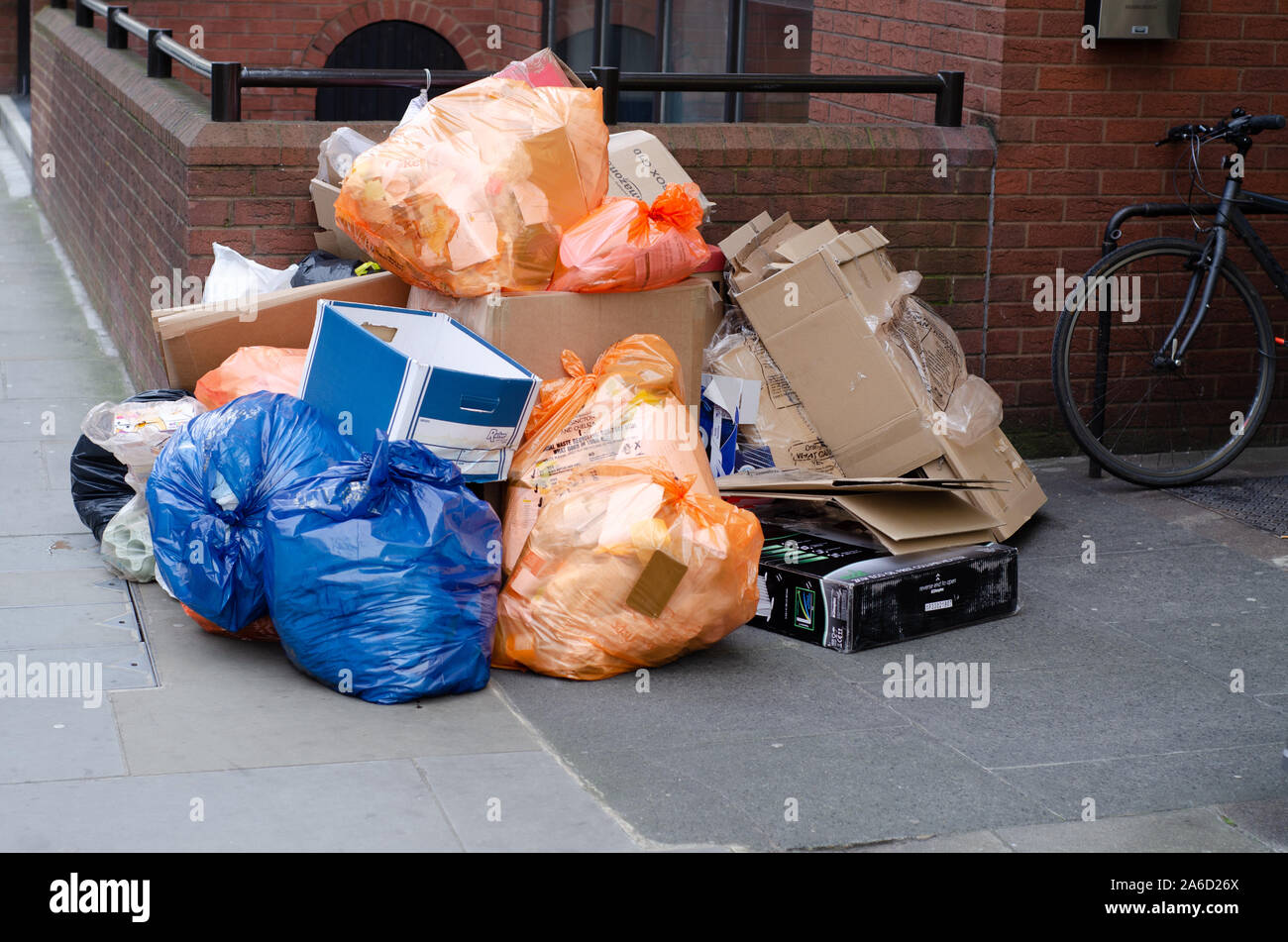 A pile of garbage (rubbish) waits to be collected on the pavement in London, England Stock Photo