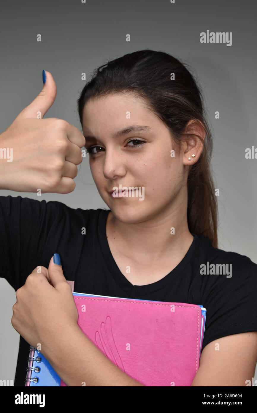 Girl Student With Thumbs Up Stock Photo - Alamy