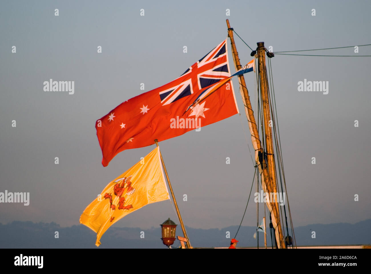 FLAGS ON THE REPLICA OF THE DUTCH BARQUE DUYFKEN, PORT ADELAIDE, SOUTH AUSTRALIA. Stock Photo