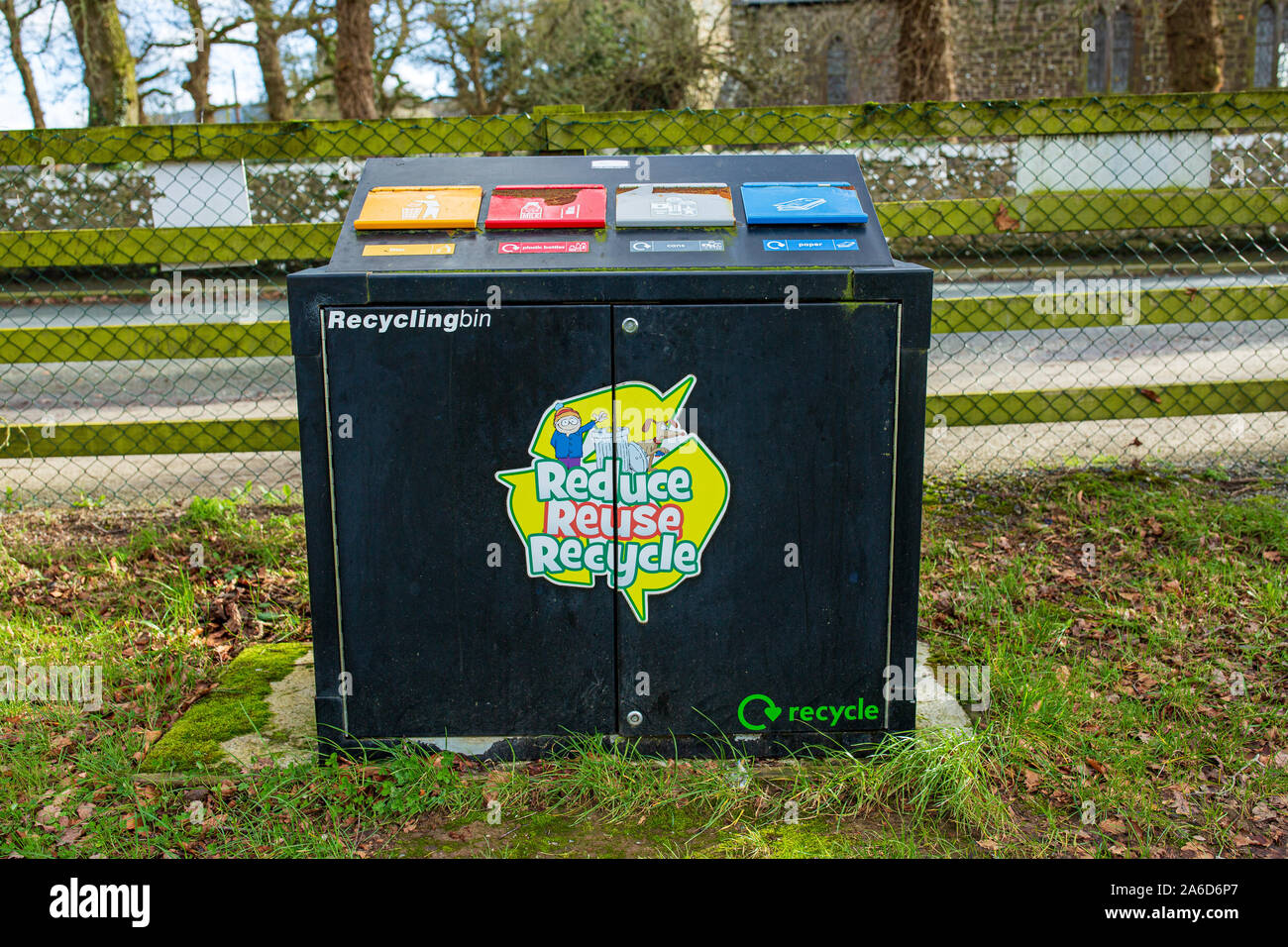 Outdoor recycling bin with four waste segregation compartments. Stock Photo