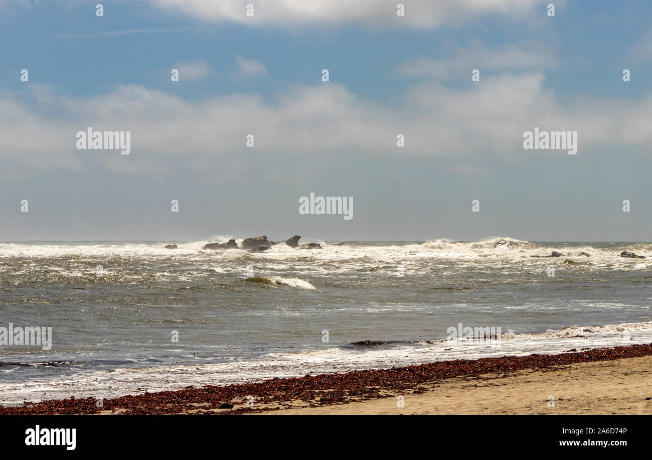 Waves crash over the rocks at Mavericks Beach, Half Moon Bay, Highway 1, Northern California. Stock Photo