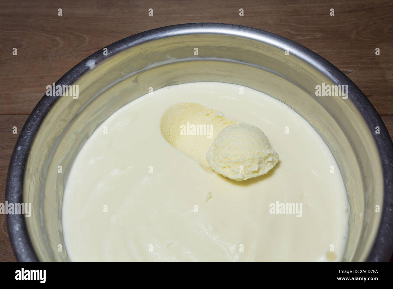 Homemade fresh milk and egg yolk based ice cream ball digging out in
