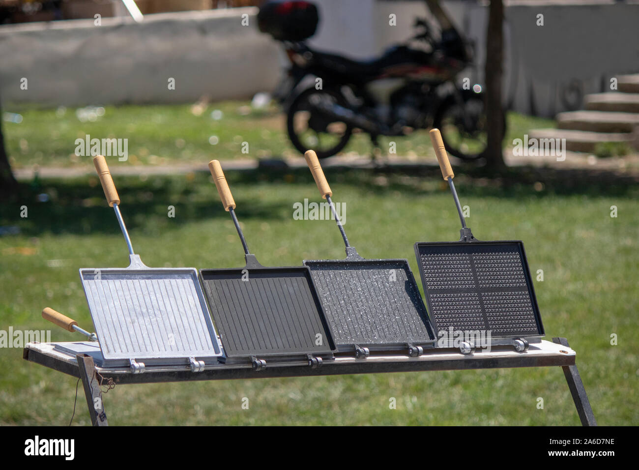 Grill on the stove. Food is compressed between two pan with lid Stock