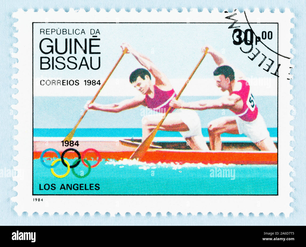 Close up of postage stamp from Guinea Bissau, featuring paddlers of 1984 Los Angeles Olympics. Stock Photo