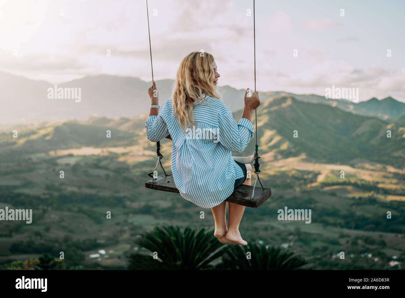 Beautiful view of young woman swing on the top of the mountan Redonda in Dominican Republic. Concept travel, vacation, tourism Stock Photo