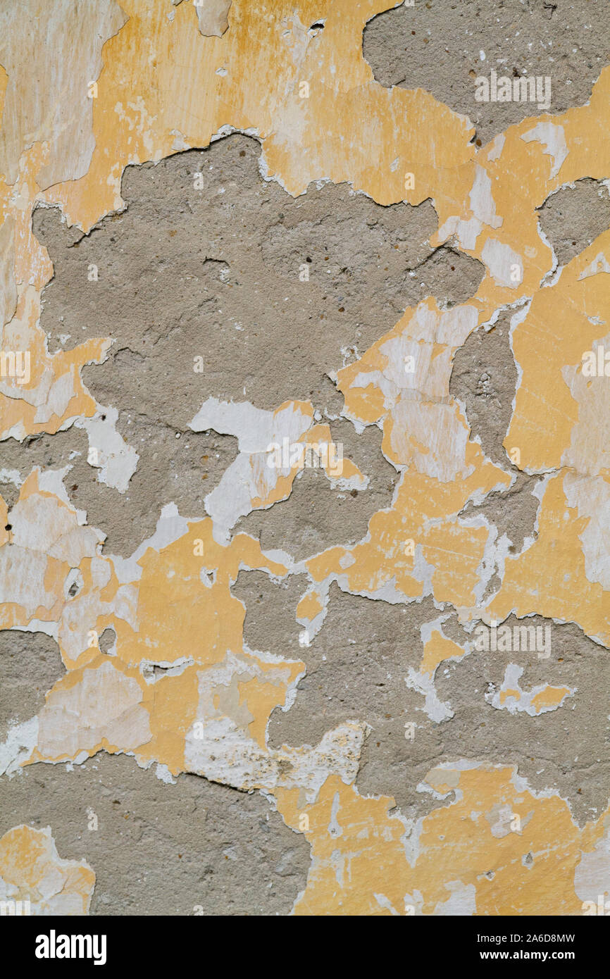 a peeling plaster on a wall Stock Photo