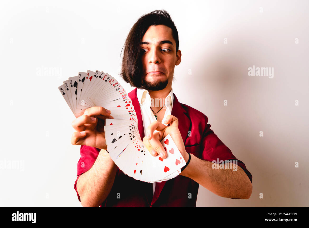 Young magician juggling a deck of playing cards Stock Photo Alamy