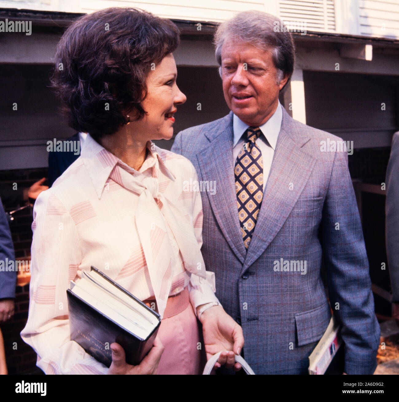 Jimmy Carter and wife Rosalynn holding Holy Bible arrive at the