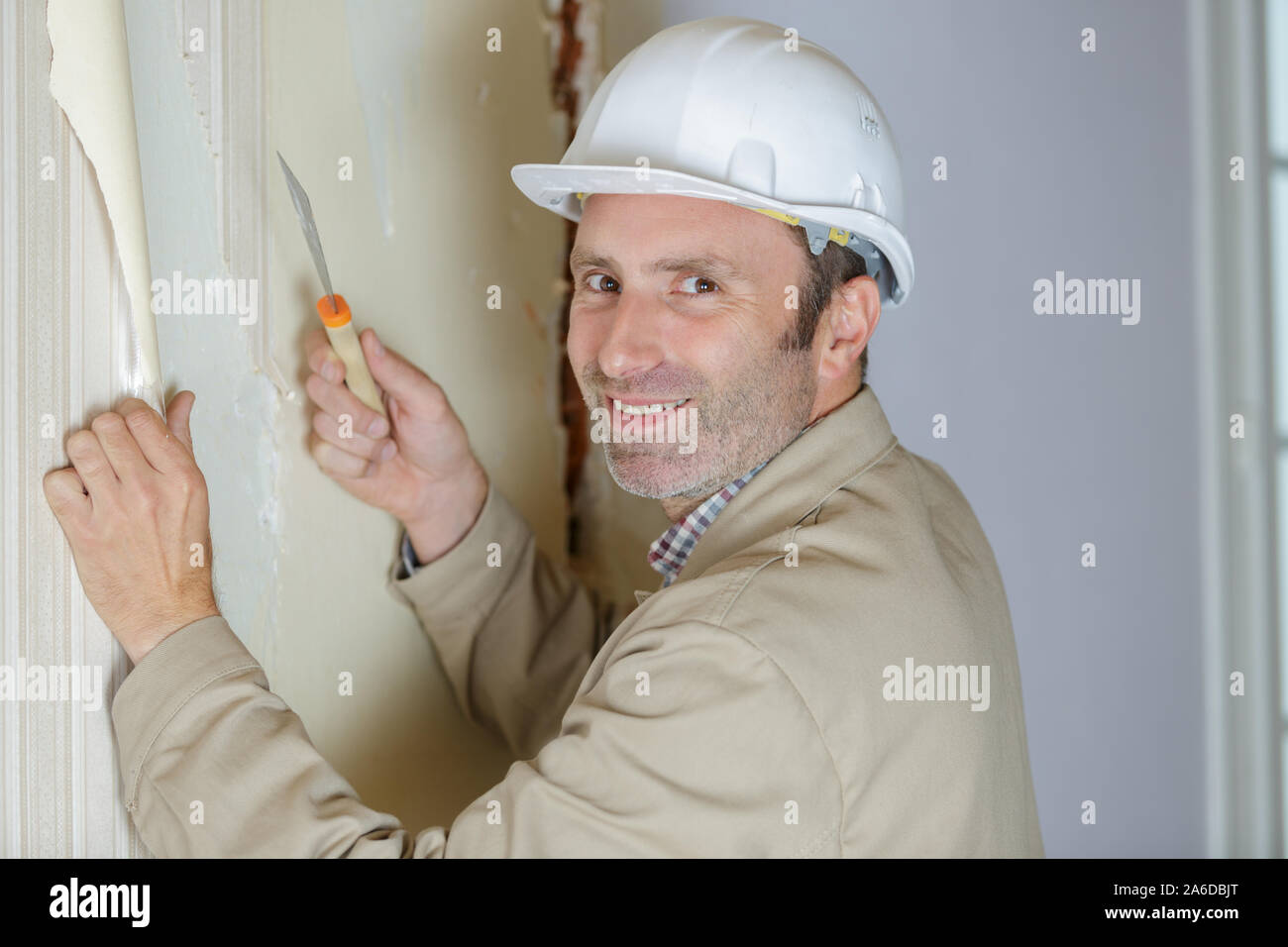 renovation of apartment wallpapering cleaning of walls Stock Photo