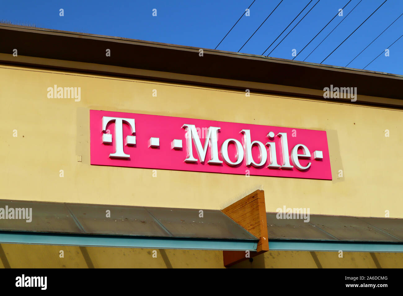 T-Mobile sign. The United States based wireless network operator whose majority shareholder is the German telecommunications company Deutsche Telekom Stock Photo