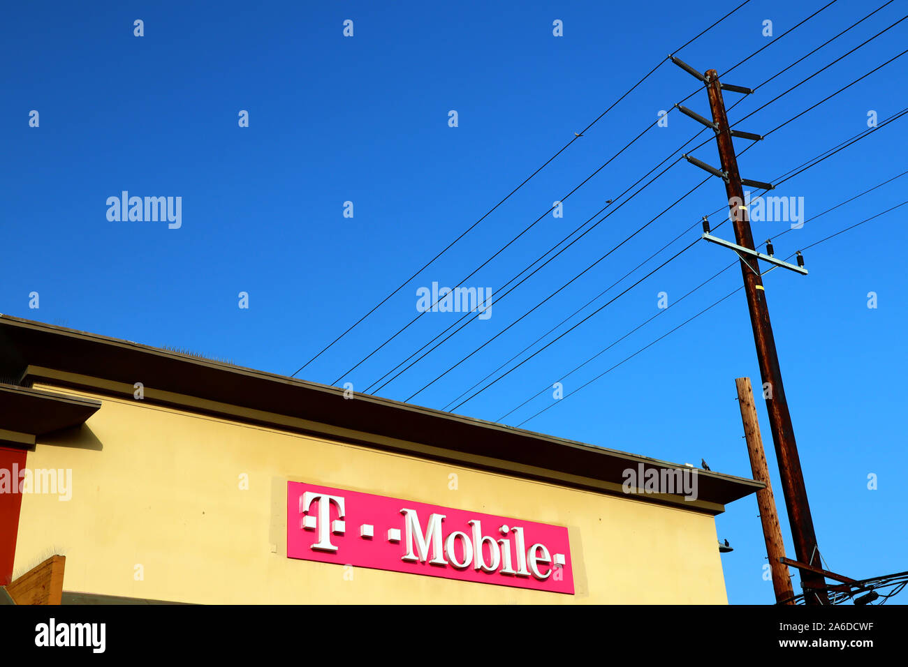 T-Mobile sign. The United States based wireless network operator whose majority shareholder is the German telecommunications company Deutsche Telekom Stock Photo