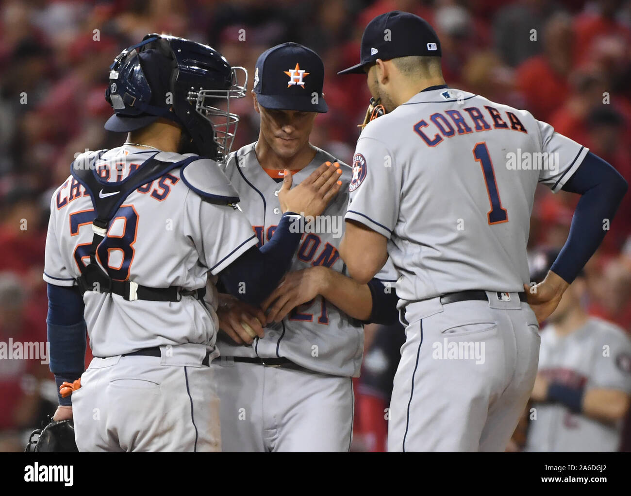 Washington, United States. 25th Oct, 2019. Washington Nationals catcher Robinson Chirinos (L) and Carlos Correa talk to opening pitcher Anibal Sanchez during Game 3 of the 2019 World Series against the Houston Astros at Nationals Park in Washington, DC on Friday, October 25, 2019. Washington leads the best-of-seven series 2-0. Photo by Kevin Dietsch/UPI Credit: UPI/Alamy Live News Stock Photo