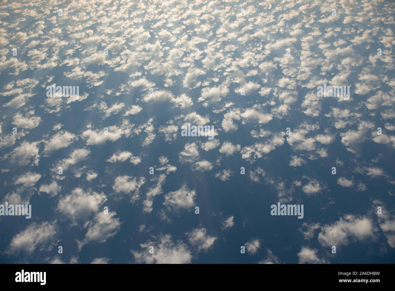 Stratocumulus clouds on a blue sky during a bright sunny day Stock Photo
