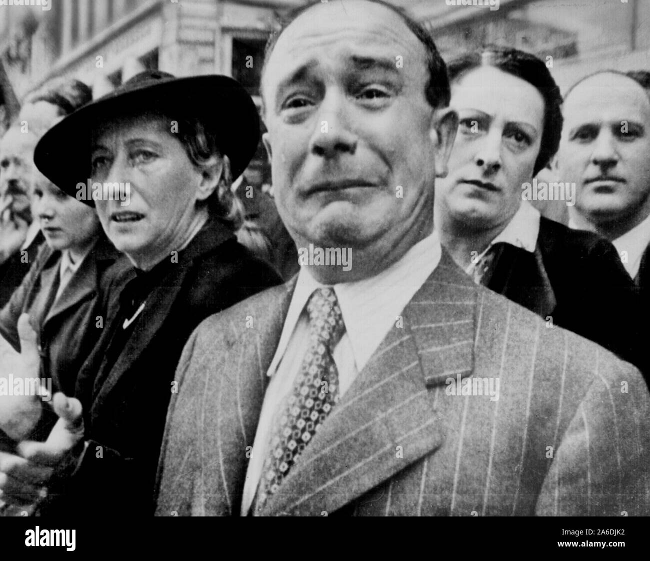 A Frenchman weeps as German soldiers march into the French capital, Paris, on June 14, 1940, after the Allied armies had been driven back across France Stock Photo