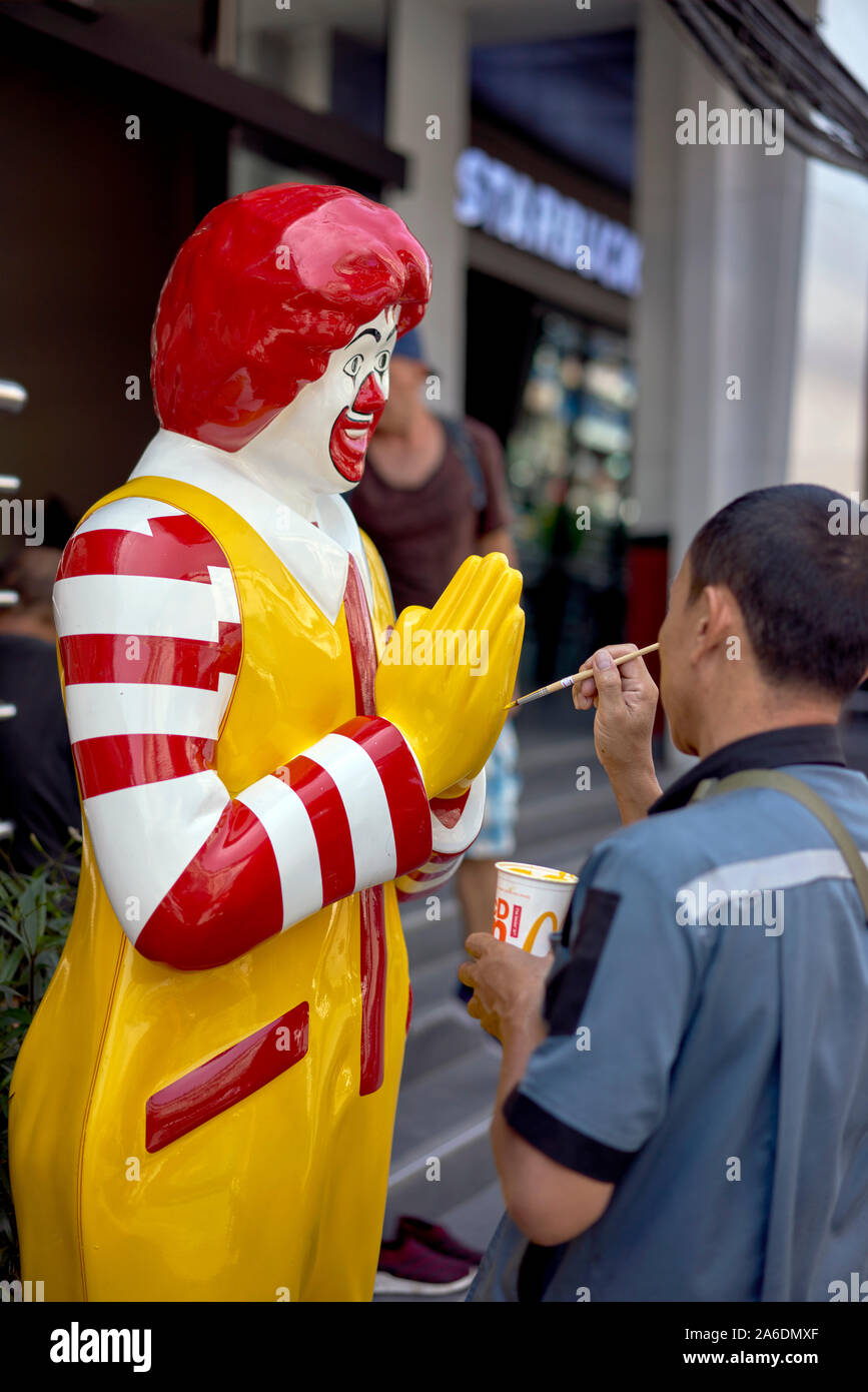 Ronald McDonald statue getting a paint repair, Thailand Southeast Asia Stock Photo