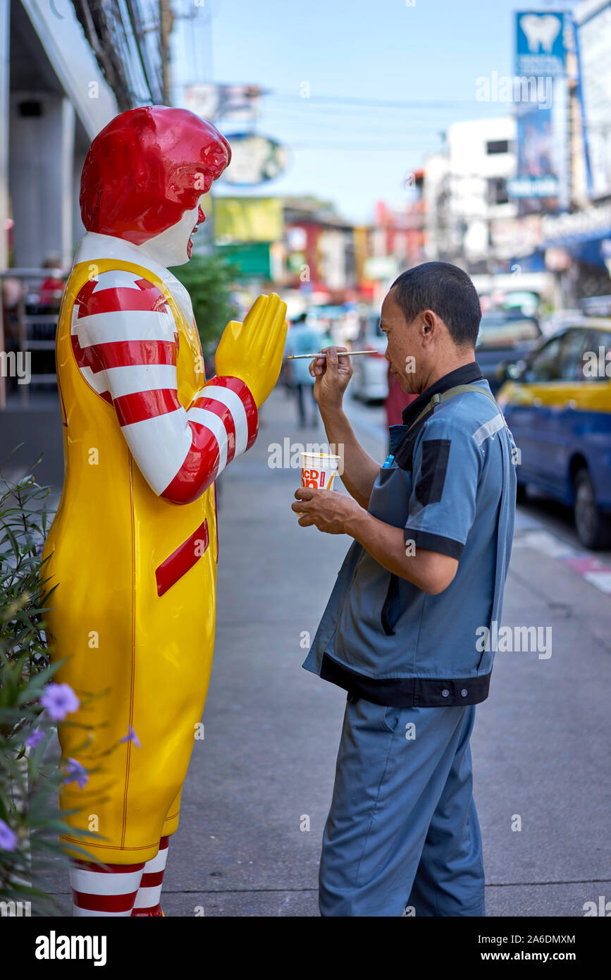 Ronald McDonald statue getting a paint repair, Thailand Southeast Asia Stock Photo