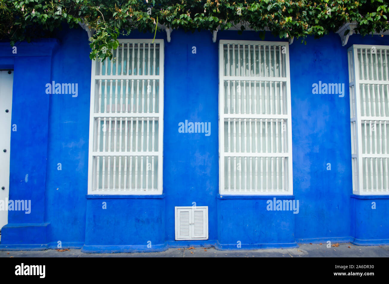 Typical spanish colonial style wooden-grating windows in Cartagena Stock Photo