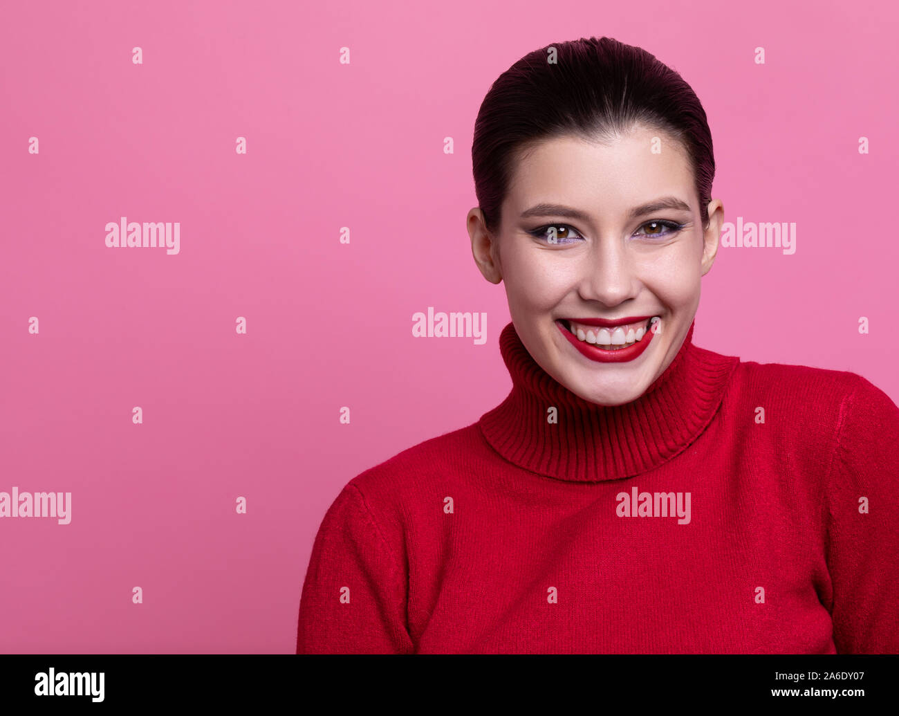girl in red sweater posing Stock Photo
