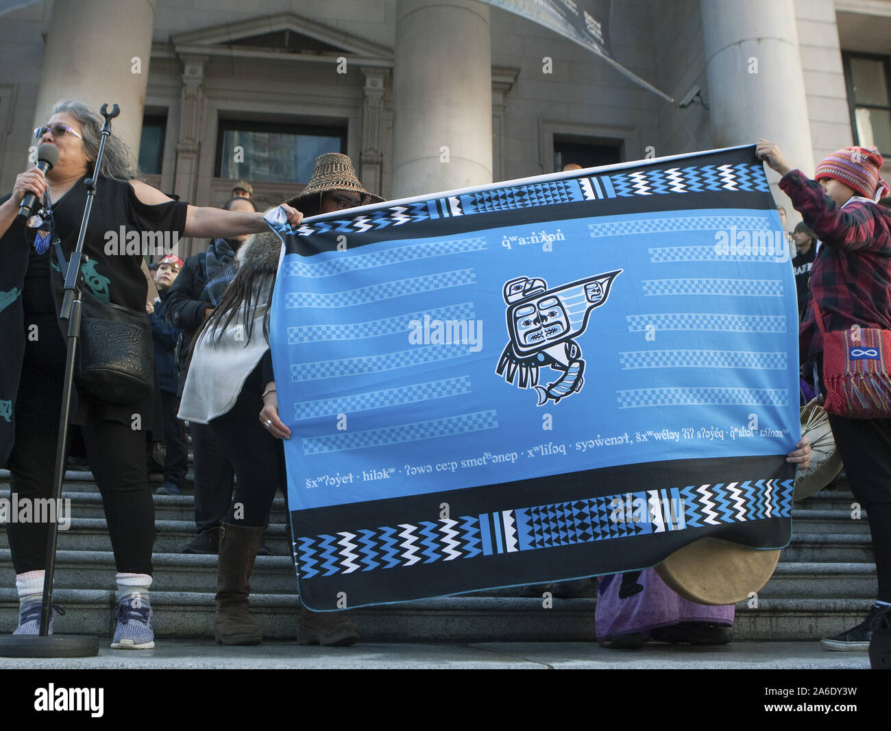 Vancouver, Canada. 25th Oct, 2019. First nations elders display a native handcrafted blanket after Swedish teen activist Greta Thunberg arrives for the post federal election Friday climate strike march starting and ending at the Vancouver Art Gallery in Vancouver, British Columbia on Friday, October 25, 2019. Organized by local youth-led, Sustainabiliteens, Greta and a turn out of nearly 10,000 climate activists demand action from industry and the various levels of government and are supporting the 15-youth who announced their plans to sue the federal government alleging it has contributed to Stock Photo