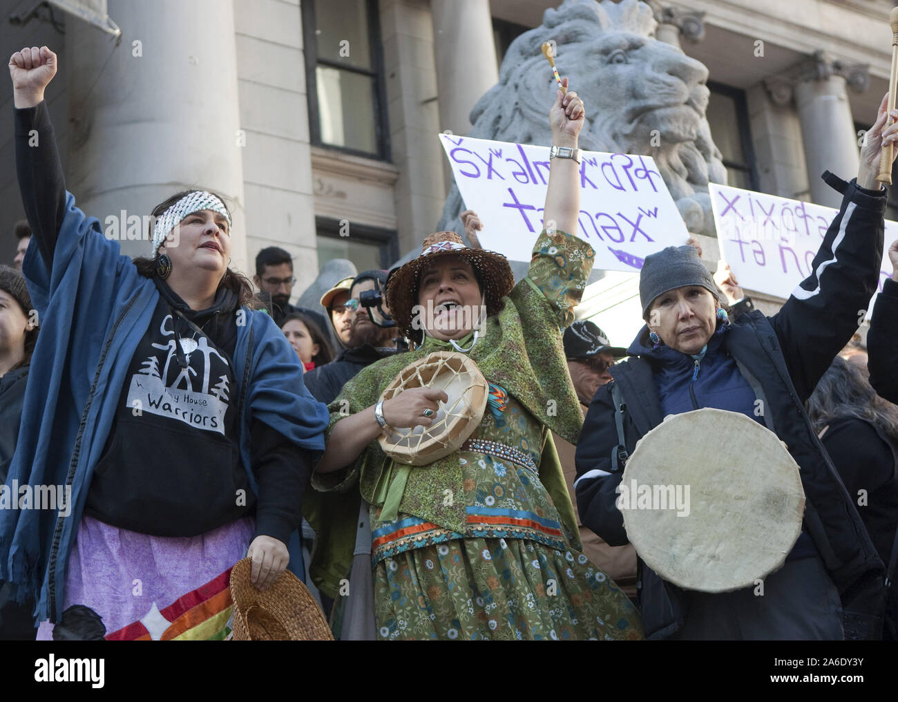 Vancouver, Canada. 25th Oct, 2019. First nations elders sing and drum after Swedish teen activist Greta Thunberg arrives for the post federal election Friday climate strike march starting and ending at the Vancouver Art Gallery in Vancouver, British Columbia on Friday, October 25, 2019. Organized by local youth-led, Sustainabiliteens, Greta and a turn out of nearly 10,000 climate activists demand action from industry and the various levels of government and are supporting the 15-youth who announced their plans to sue the federal government alleging it has contributed to climate change. Credit: Stock Photo