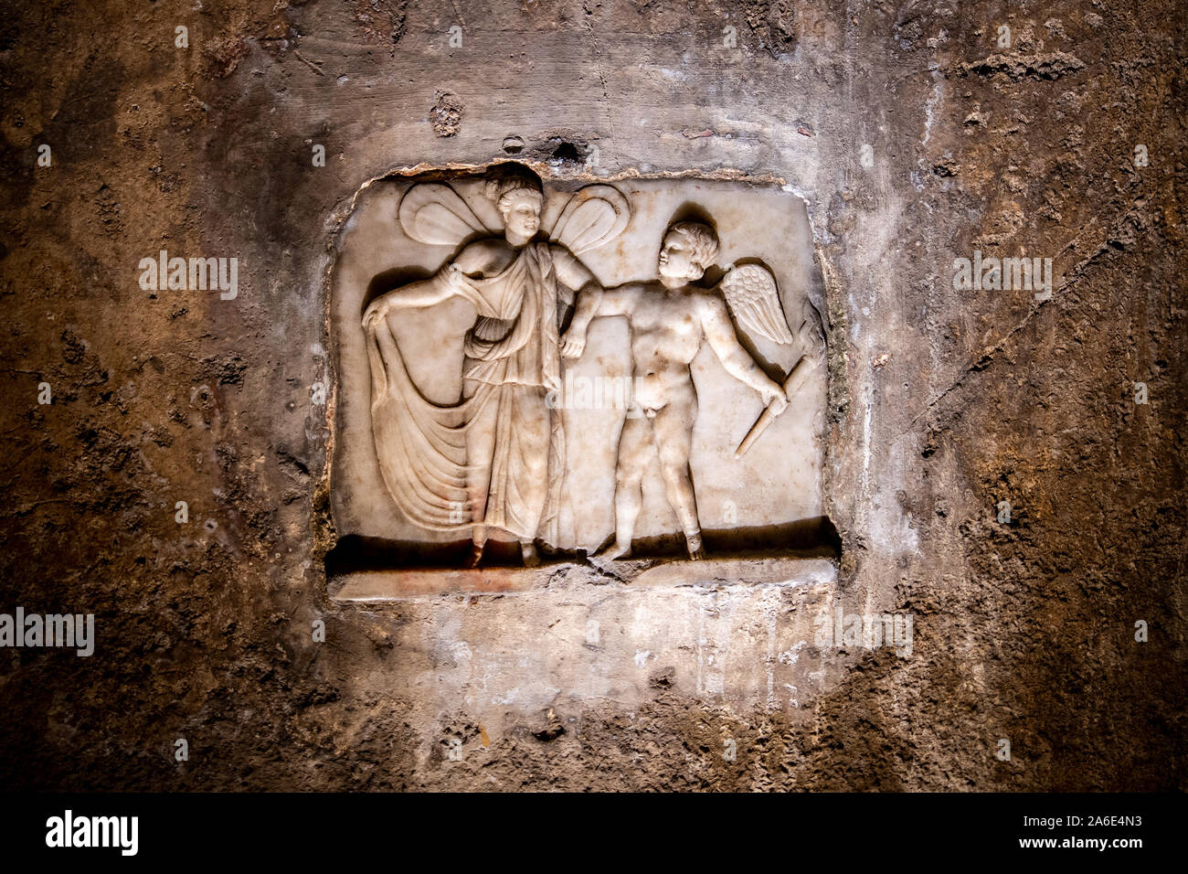 Bas relief with Love and Psyche, symbol of the soul elevated by mystical love inside of the Mithraeum of Ancient Capua, Caserta, Italy Stock Photo