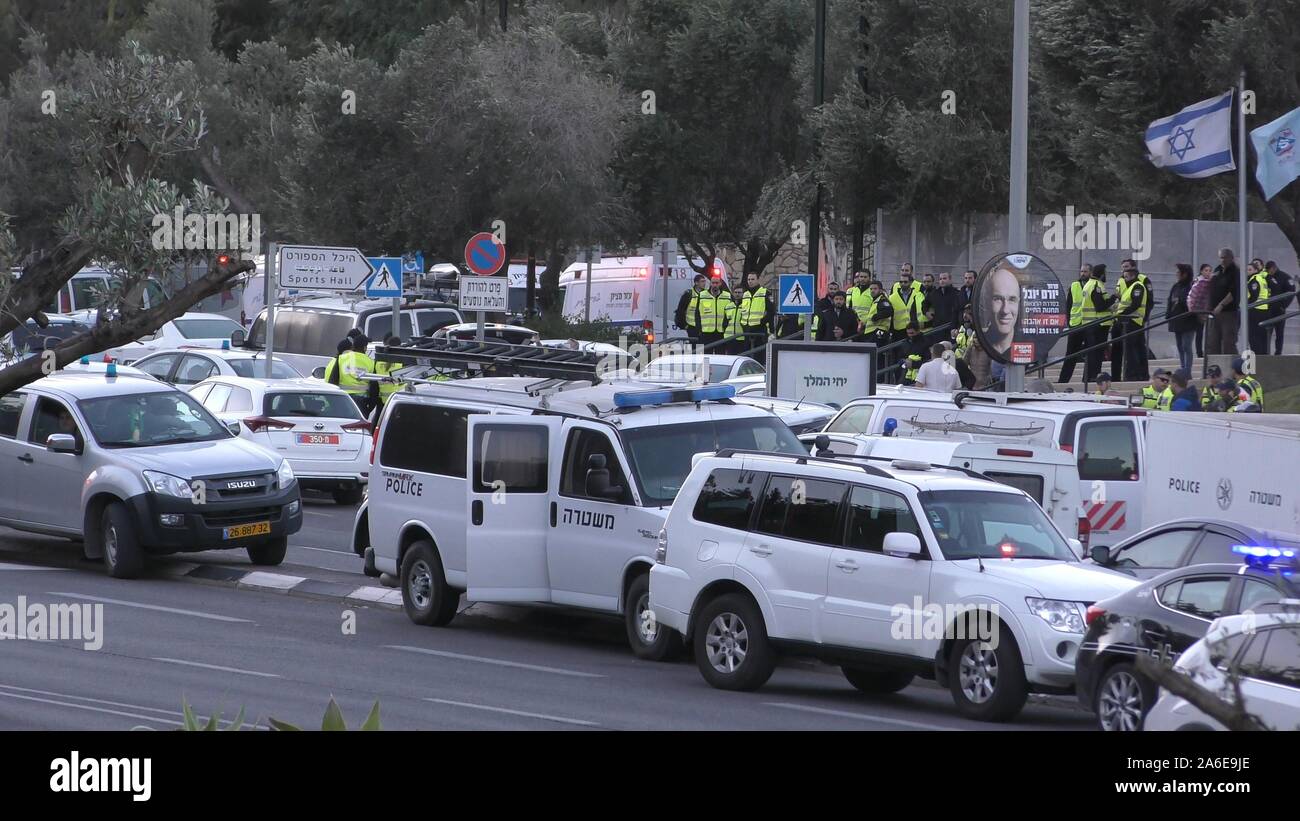 Policemen and police cars gather near headquarters in Romema during fires in Haifa. Stock Photo