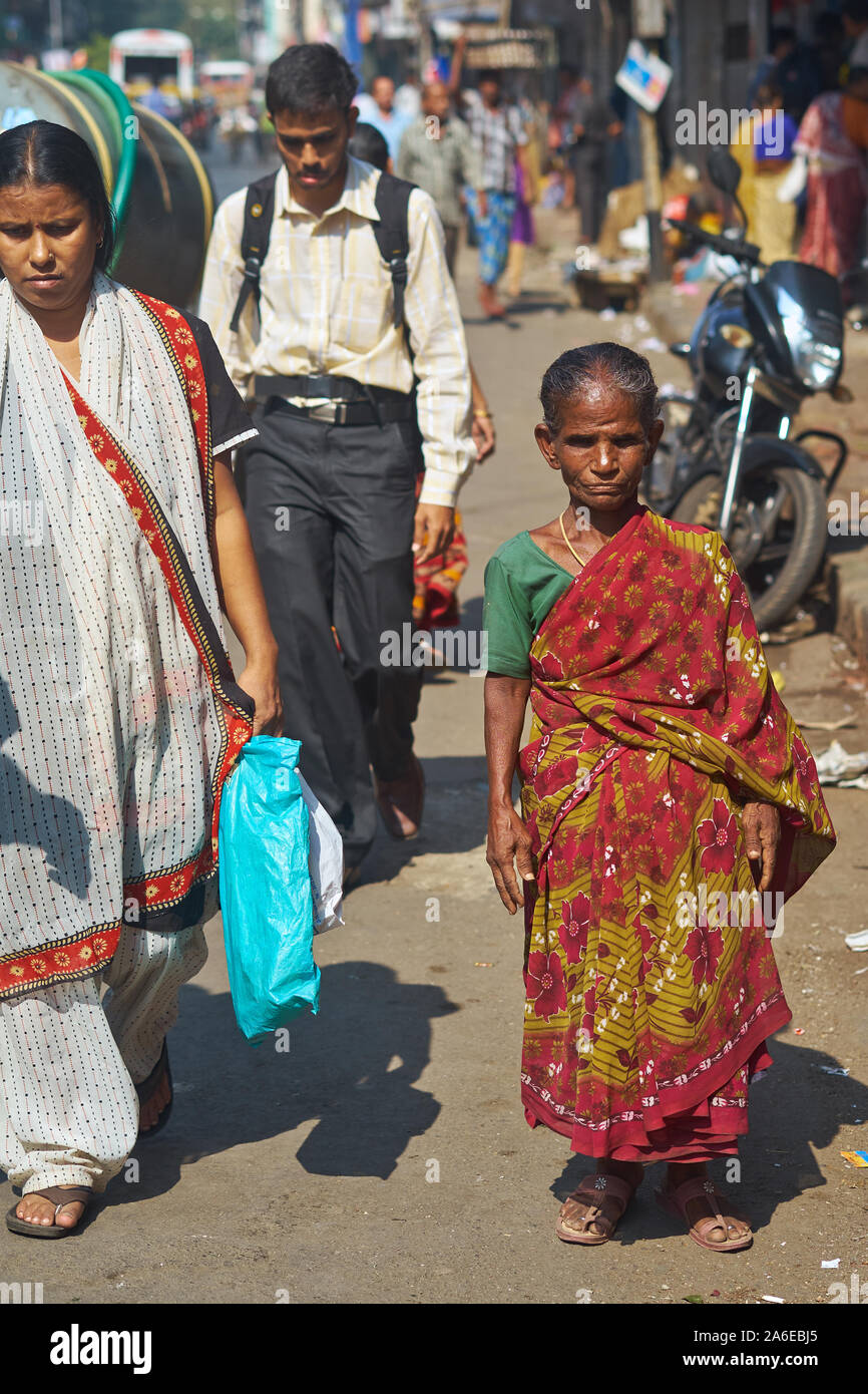 A woman suffering from dwarfism, in a street in Mumbai, India Stock Photo