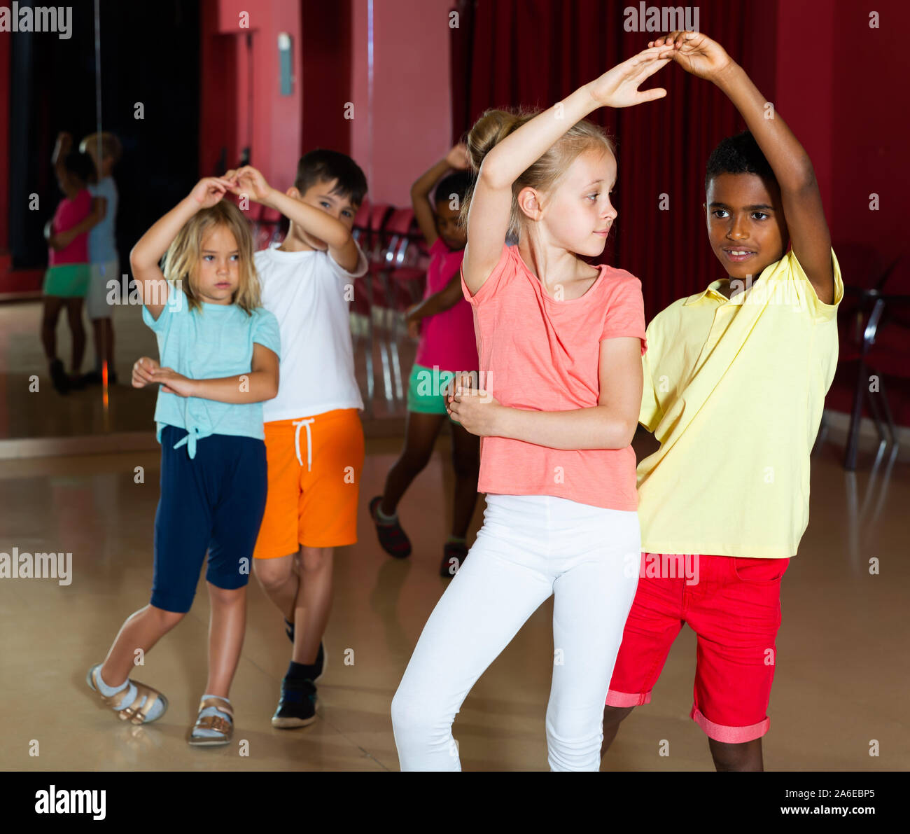 Group of friendly kids dancing salsa dance in modern studio Stock Photo Alamy