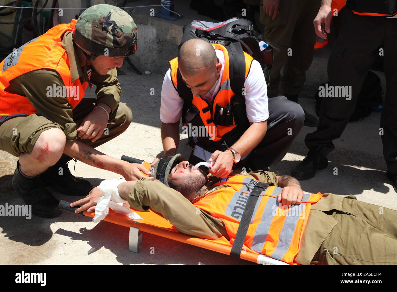 Paramedics treat rocket attack casualties in Carmel Prison, Israel, during simulation drill Turning Point 15. Emergency forces practice rescue and first aid treatment to injured Stock Photo