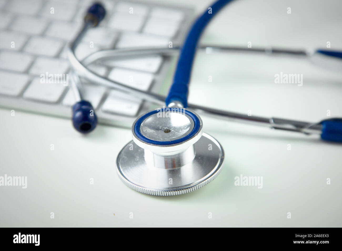 Stethoscope on laptop keyboard. Concept 3D image. Stock Photo