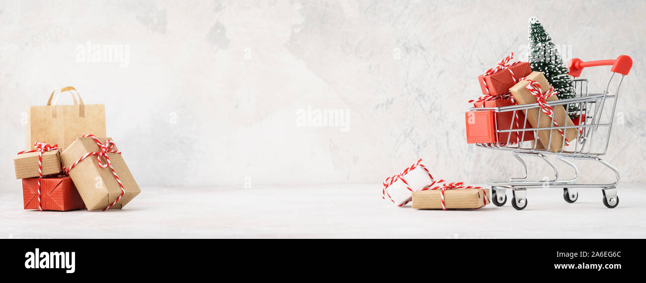 Shopping Cart Or Trolley Full Of Gift Boxes And A Christmas Tree Xmas Sale Concept Banner With Copy Space Stock Photo Alamy