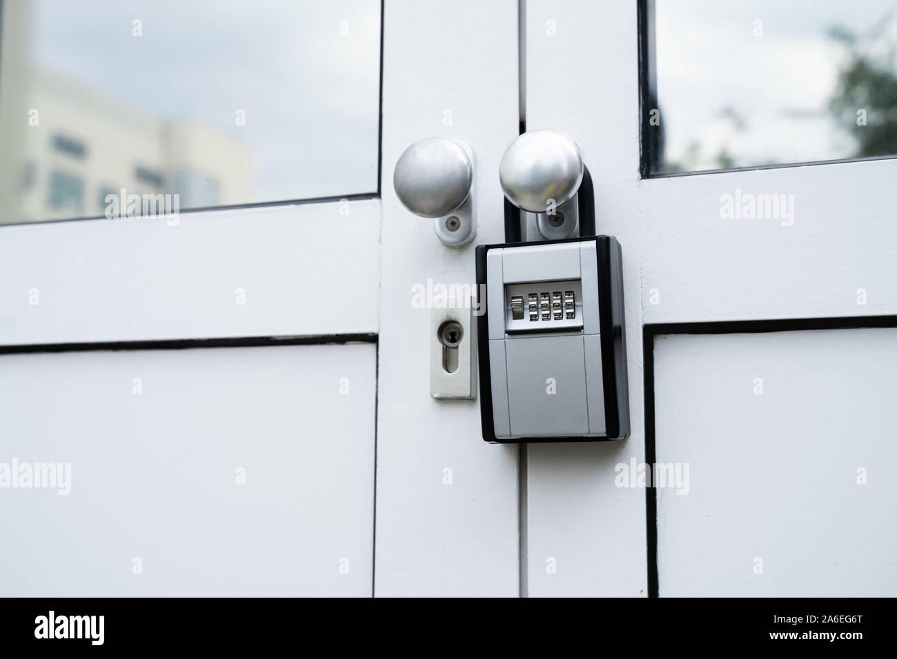 Key Safe Hanging On The Door With Keys Securely Stored Inside Stock Photo