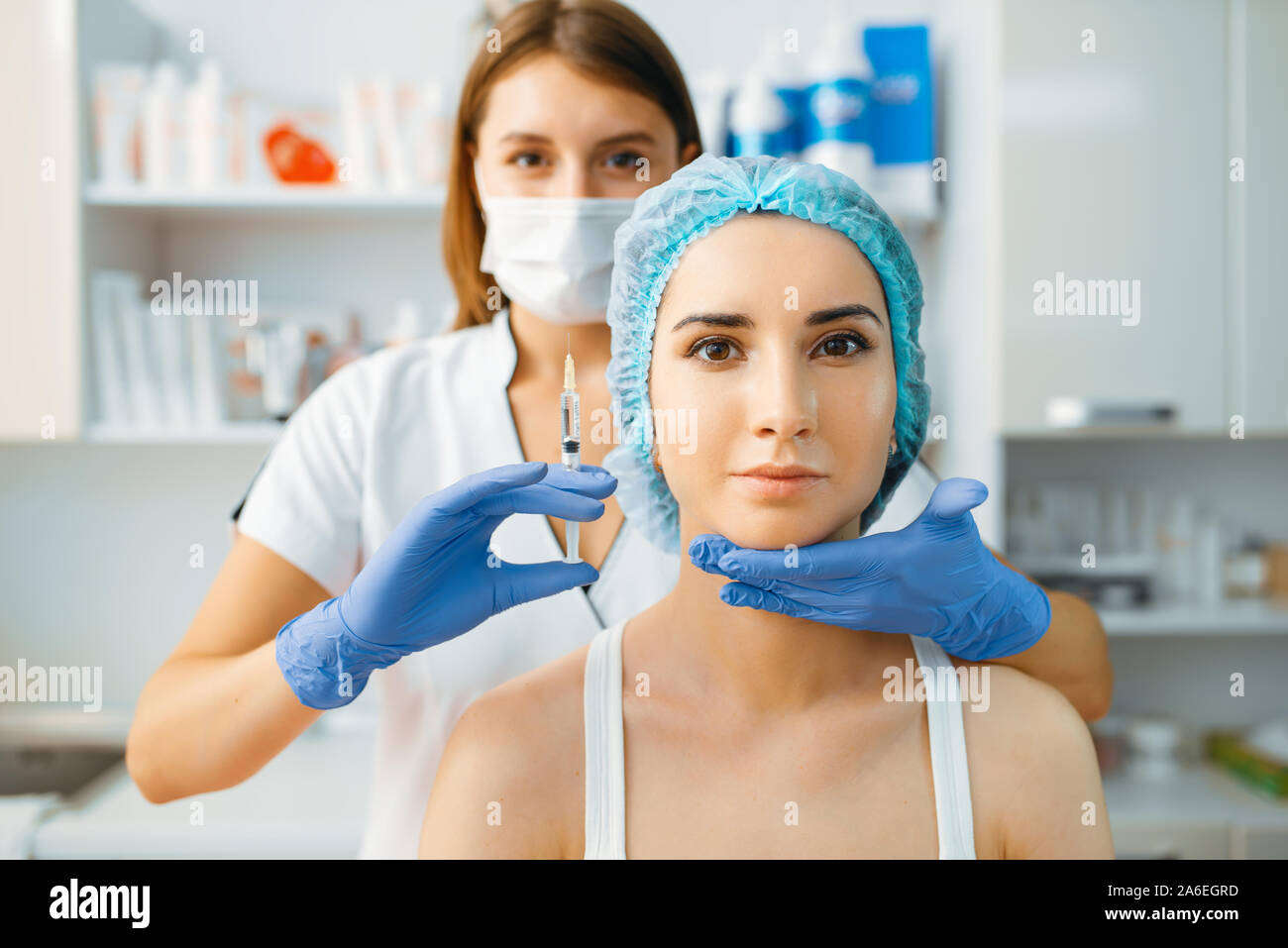 Cosmetician holds syringe with injection of botox Stock Photo Alamy