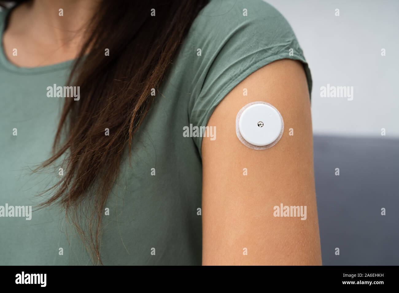 Closeup Of A Woman Testing Glucose Level With A Continuous Glucose