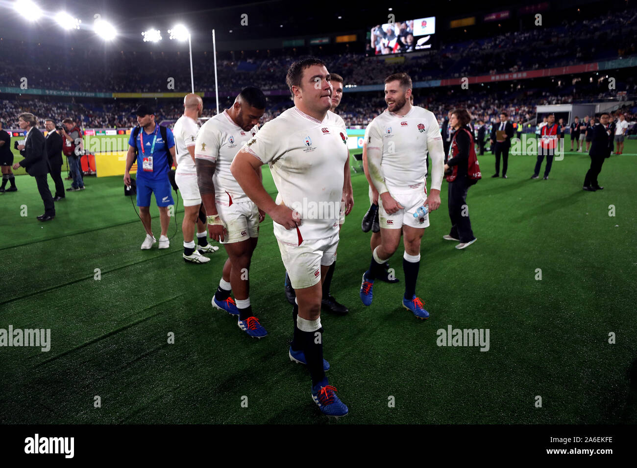 England's Jamie and his teammates walk off the pitch after the