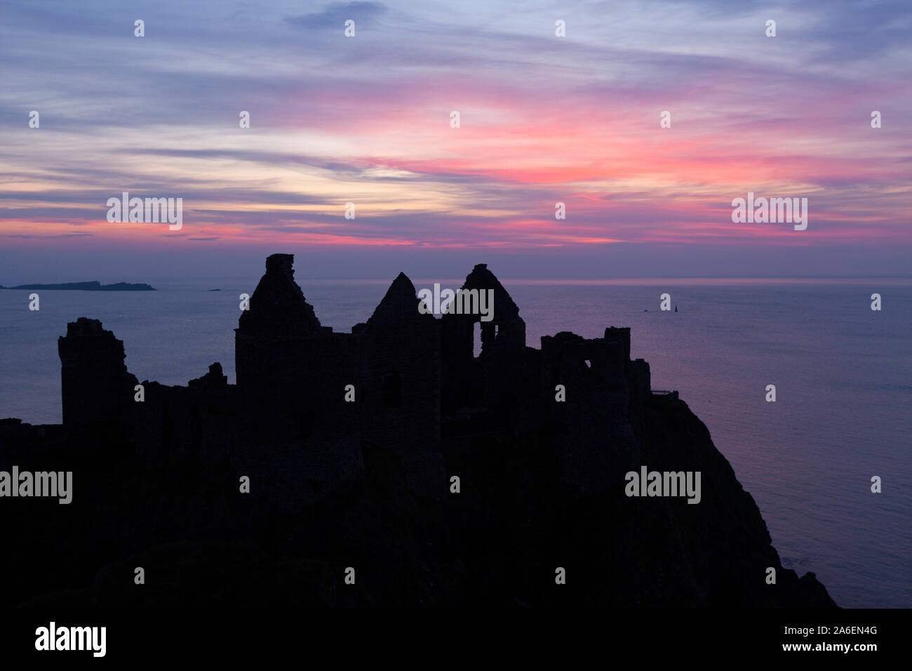 Sunset at Dunluce Castle in County Antrim, Northern Ireland. Stock Photo