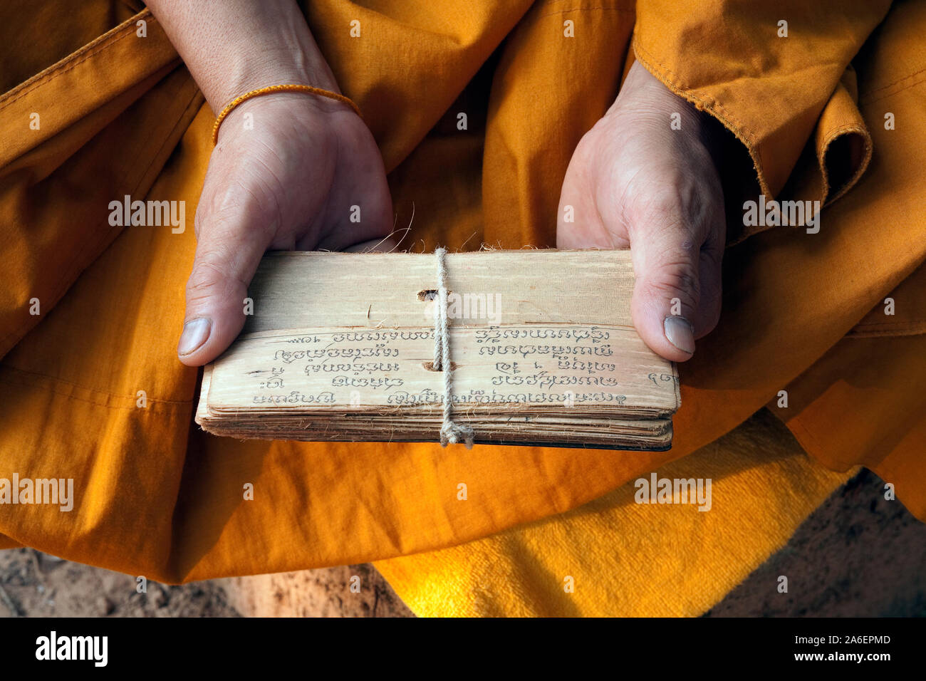 Buddhist monk holding a holy Buddhist parchment at Angkor Wat Stock Photo