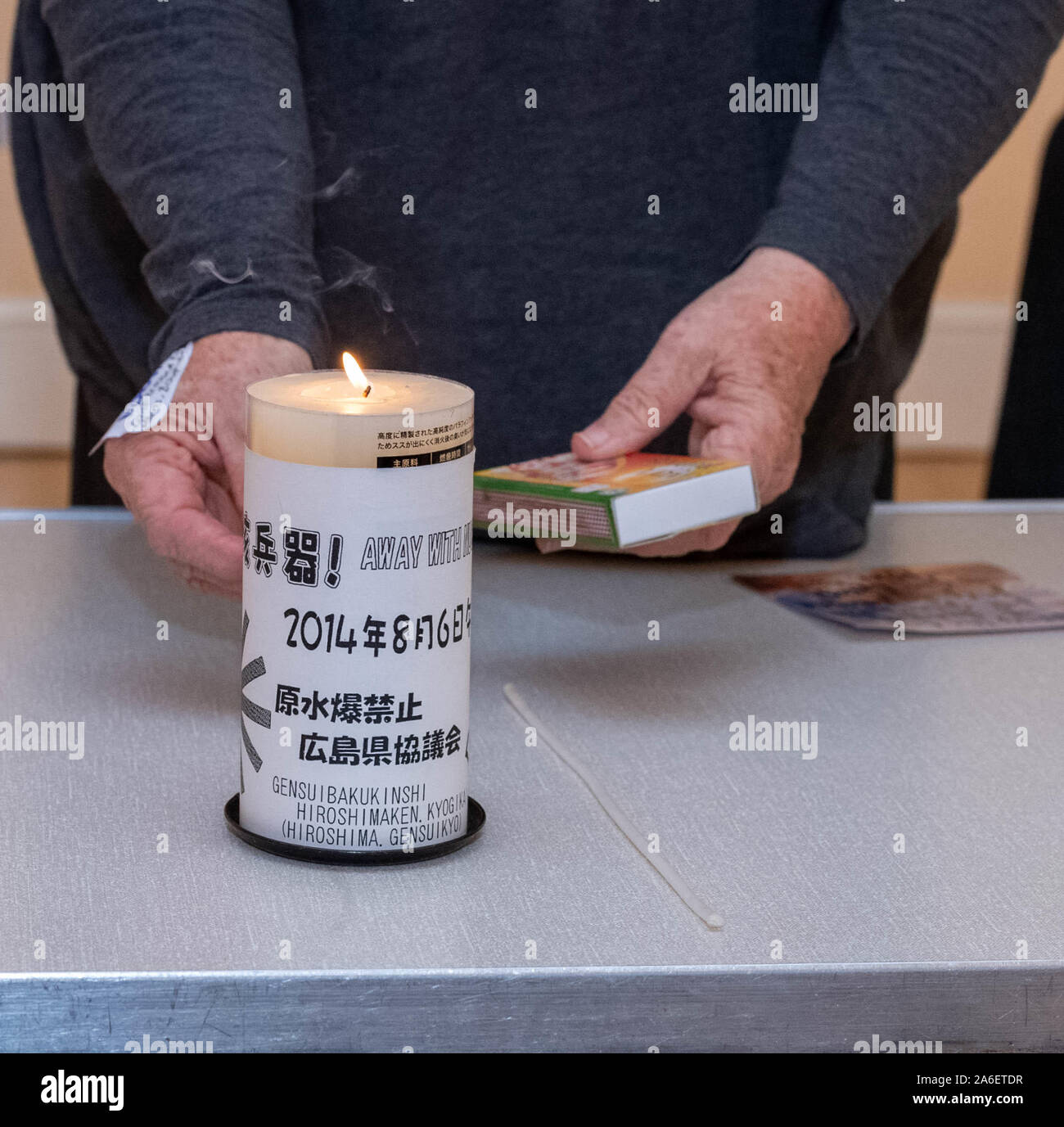 Brentwood Essex UK, 26th Oct.2019 Christian Campaing for Nuclear Disarmament annual General meeting at Brentwood Cathedral, Brentwood, UK on the theme 'Unclear wepons, the other extinction threat', Lighting of the peace candle by Caroline Gilbert co-chair Credit Ian DavidsonAlamy Live News Stock Photo
