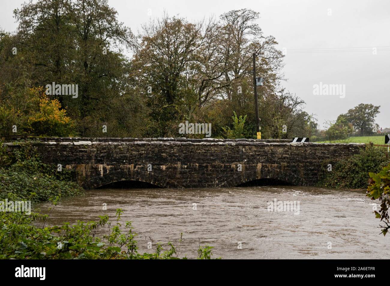 Cardiff, Wales, Uk. 26th Oct, 2019. Peterston-Super-Ely, Wales, UK, October 26th 2019. The swollen Ely River creeps to the top of the arches of a road bridge near Cardiff as heavy rain falls across much of Wales, with a Met Office amber warning in place for parts of south-east and south-west Wales. Credit: Mark Hawkins/Alamy Live News Stock Photo