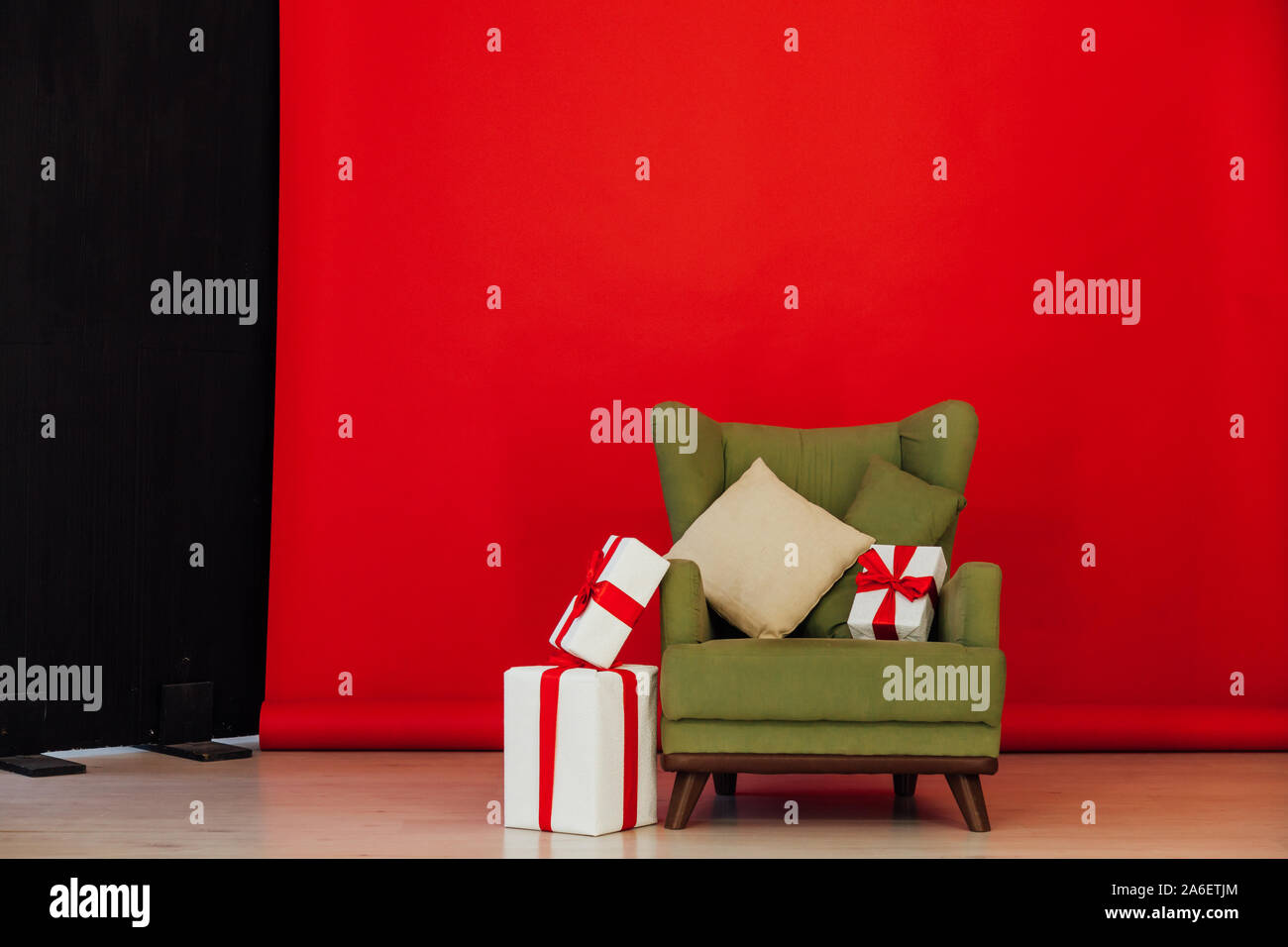 green vintage chair in the interior of the red black room Stock Photo