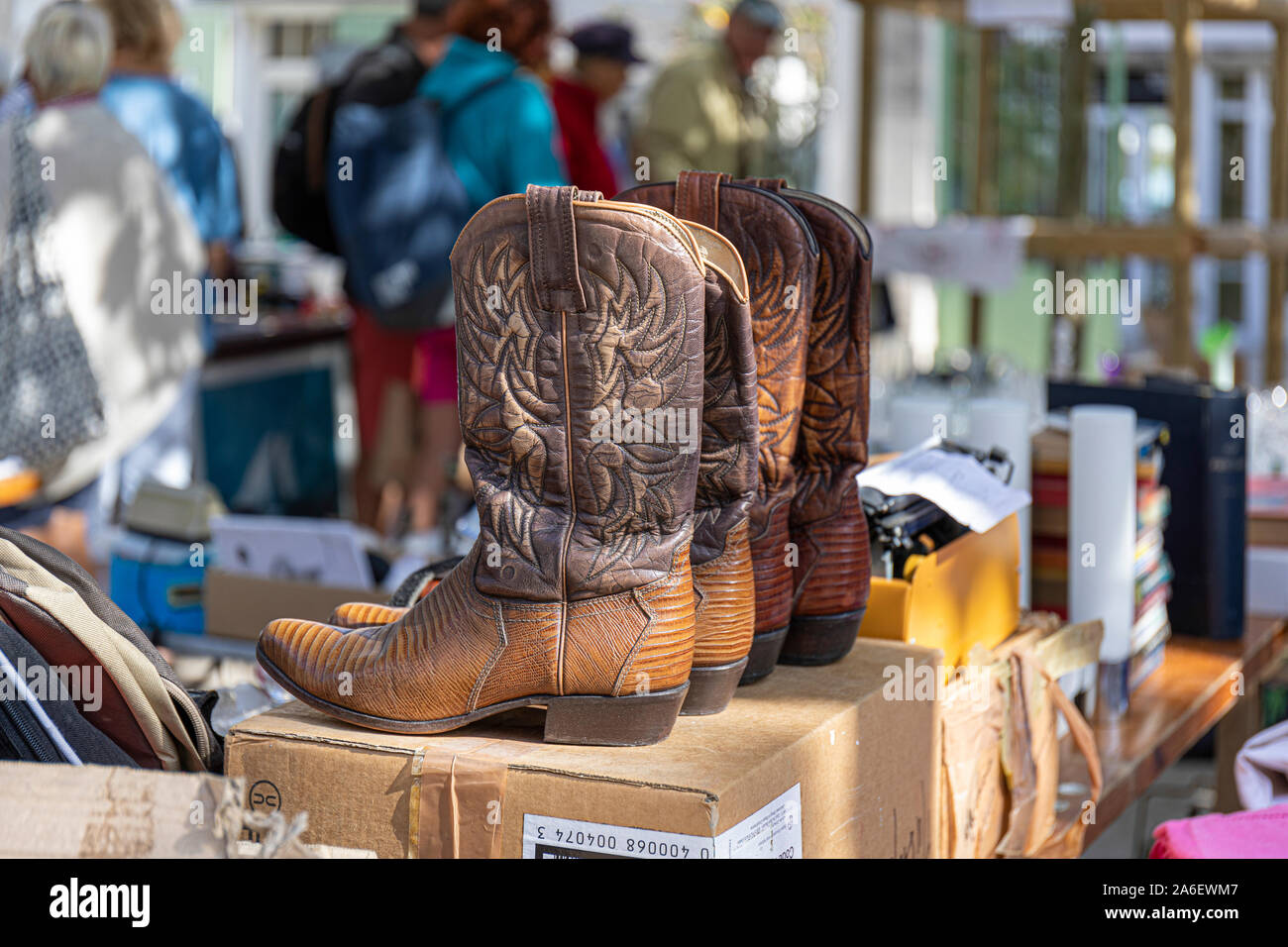 The Antiques market, La Flotte, Ile de Re, France.  Cowboy boots for sale Stock Photo