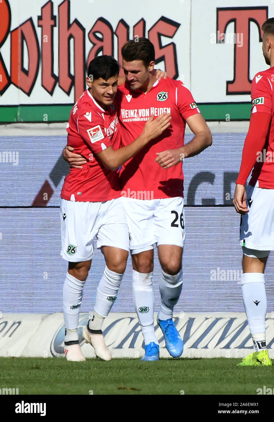 Karlsruhe, Germany. 26th Oct, 2019. Soccer: 2nd Bundesliga, Karlsruher SC - Hannover 96, 11th matchday in the Wildparkstadion. The Hanoverians Hendrik Weydandt (r) and Miiko Albornoz cheer the goal to 0:1 by Hendrik Weydandt. Credit: Uli Deck/dpa - IMPORTANT NOTE: In accordance with the requirements of the DFL Deutsche Fußball Liga or the DFB Deutscher Fußball-Bund, it is prohibited to use or have used photographs taken in the stadium and/or the match in the form of sequence images and/or video-like photo sequences./dpa/Alamy Live News Stock Photo