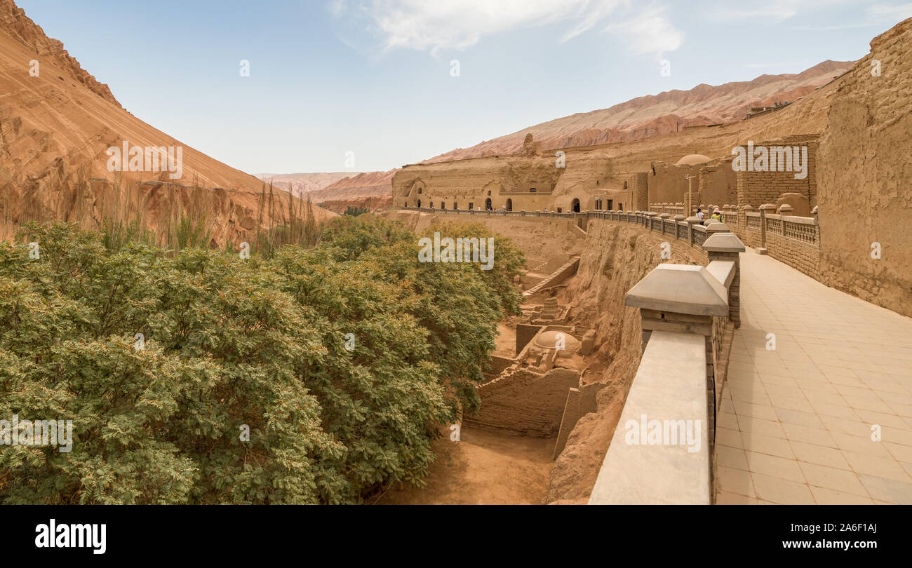 Composed by 77 rock-cut caves, each with the ceiling covered with Buddha murals, the Bezeklik Caves are among the main attractions of Turpan Stock Photo