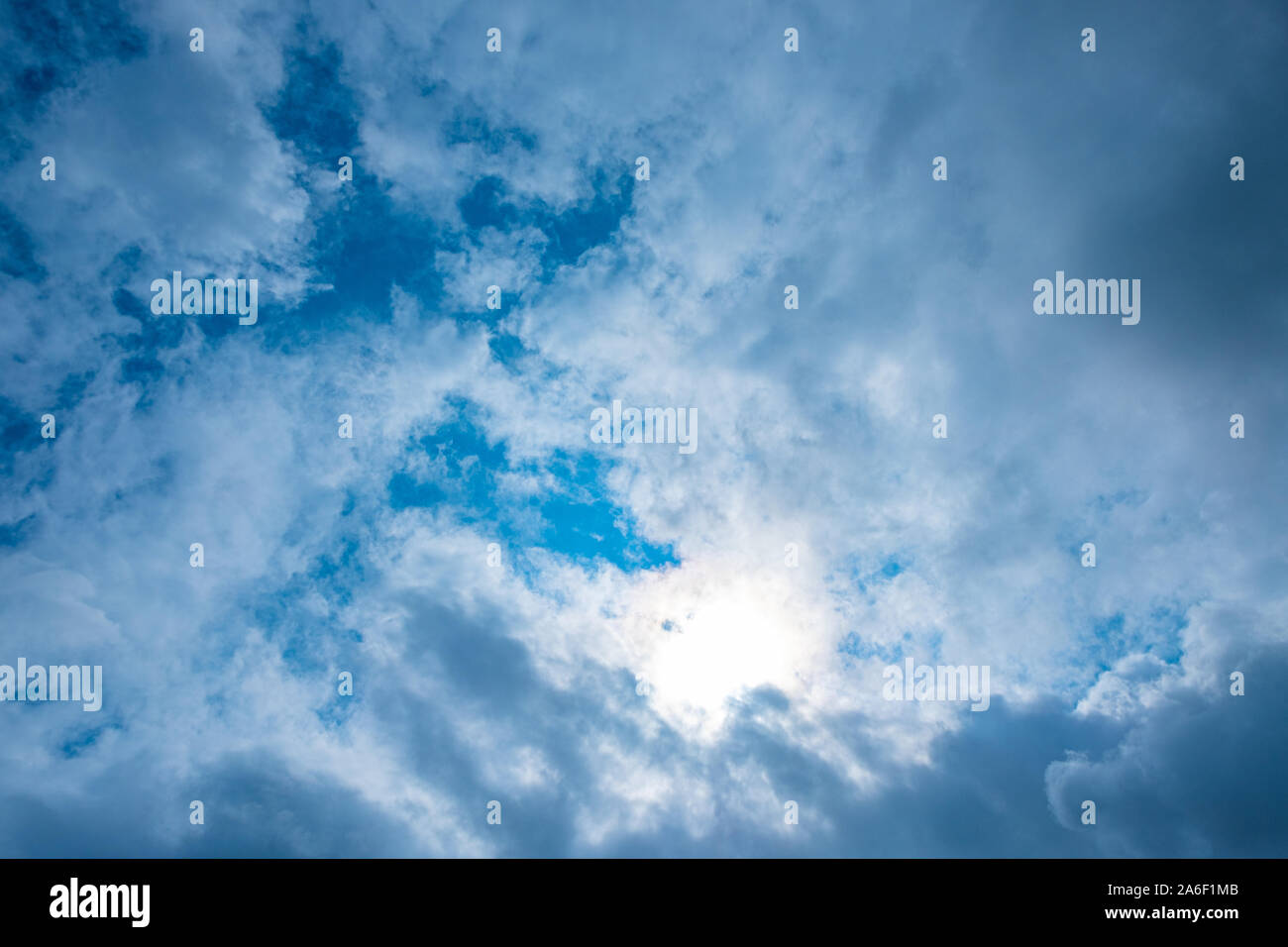 Blue sky with the stormy clouds and sun Stock Photo - Alamy