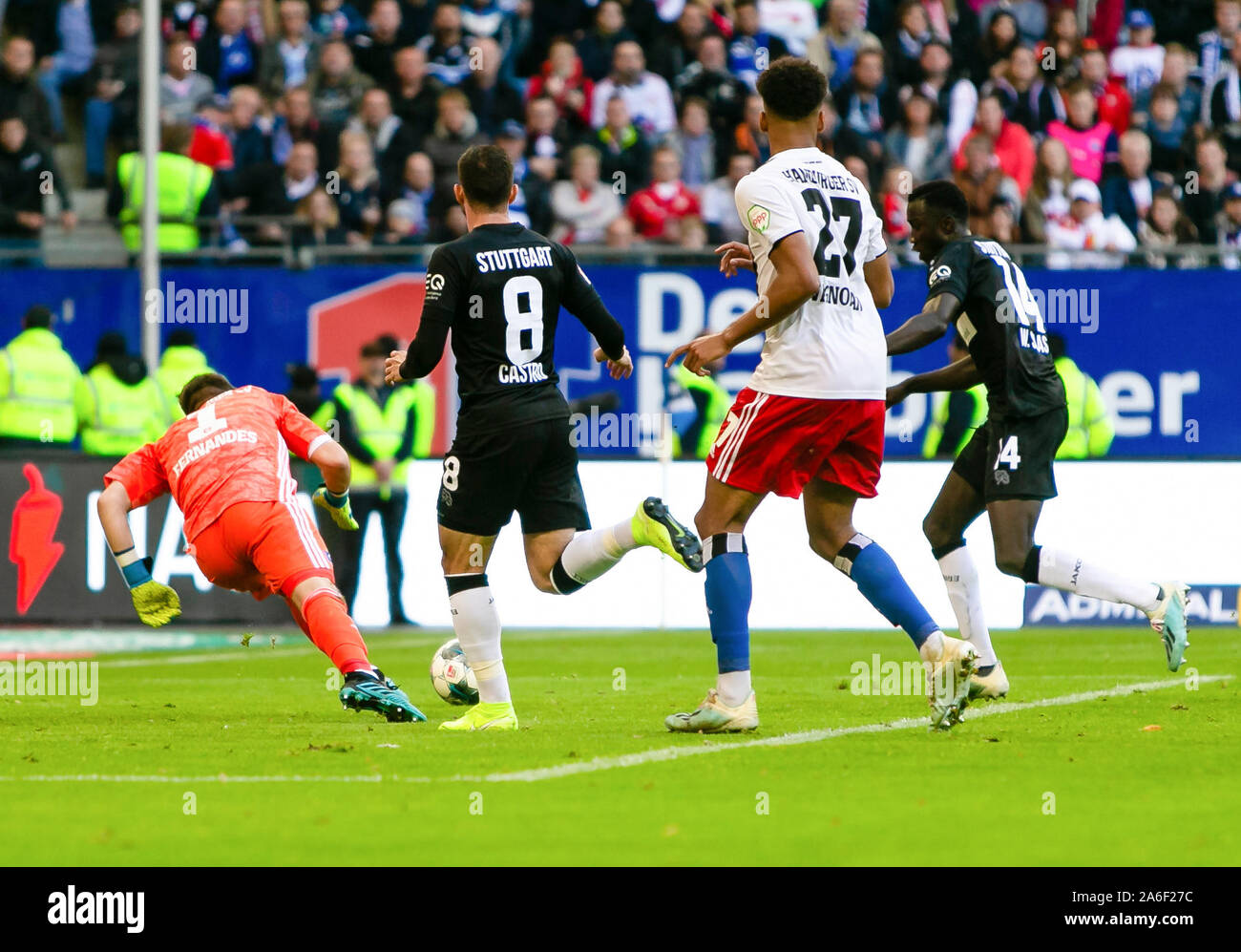 25 October 2019, Hamburg: Soccer: 2nd Bundesliga, Hamburger SV - VfB Stuttgart, 11th matchday in Volksparkstadion. Stuttgart's Silas Wamangituka (r) scores against Hamburg's Daniel Heuer Fernandes (l) for 2-4 for VfB. Stuttgart Gonzalo Castro and Hamburg's Josha Vagnoman (2nd from right) are watching. Photo: Frank Molter/dpa - IMPORTANT NOTE: In accordance with the requirements of the DFL Deutsche Fußball Liga or the DFB Deutscher Fußball-Bund, it is prohibited to use or have used photographs taken in the stadium and/or the match in the form of sequence images and/or video-like photo sequences Stock Photo