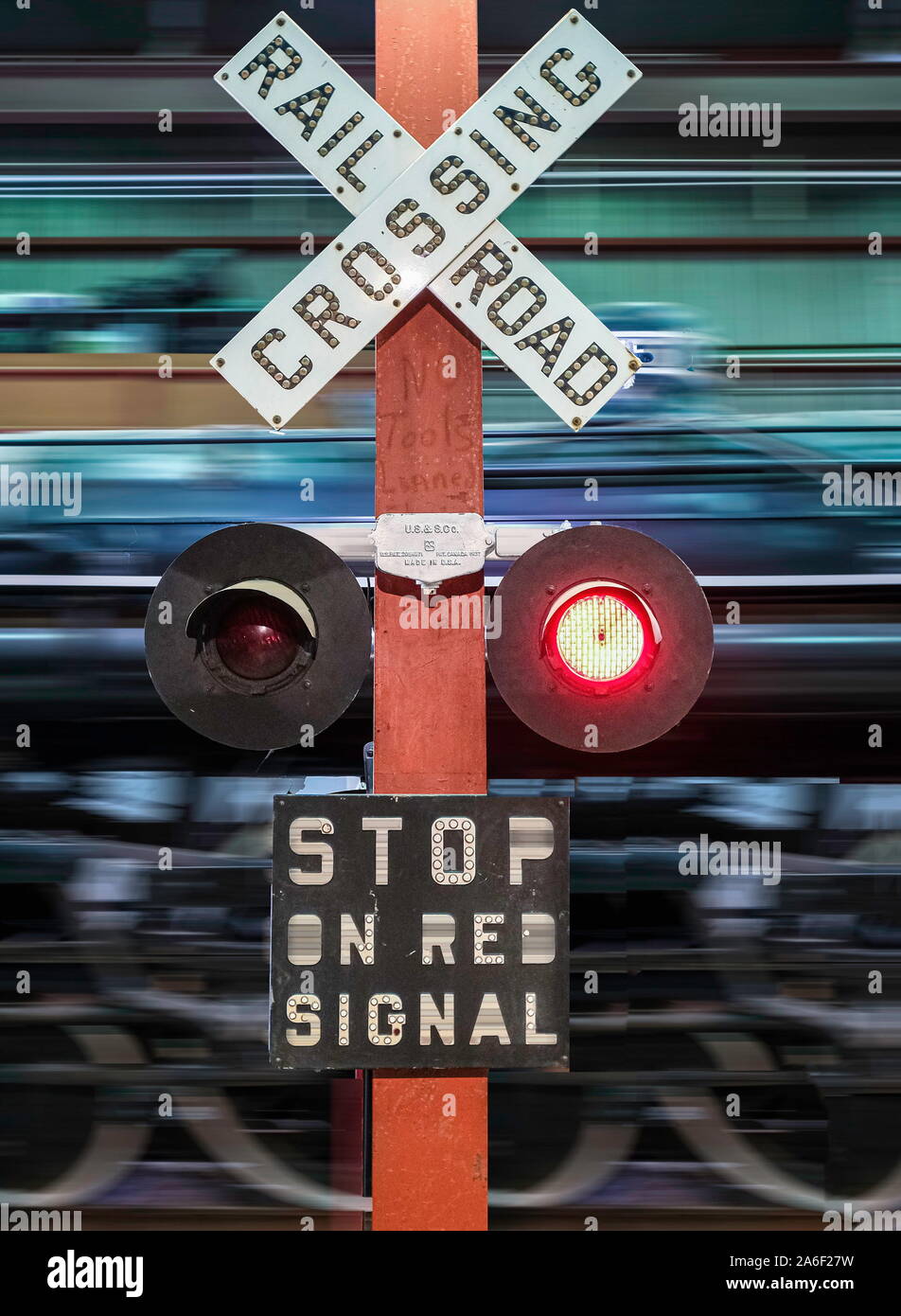 Railroad Crossing Flashing with Train Speeding Past Stock Photo Alamy