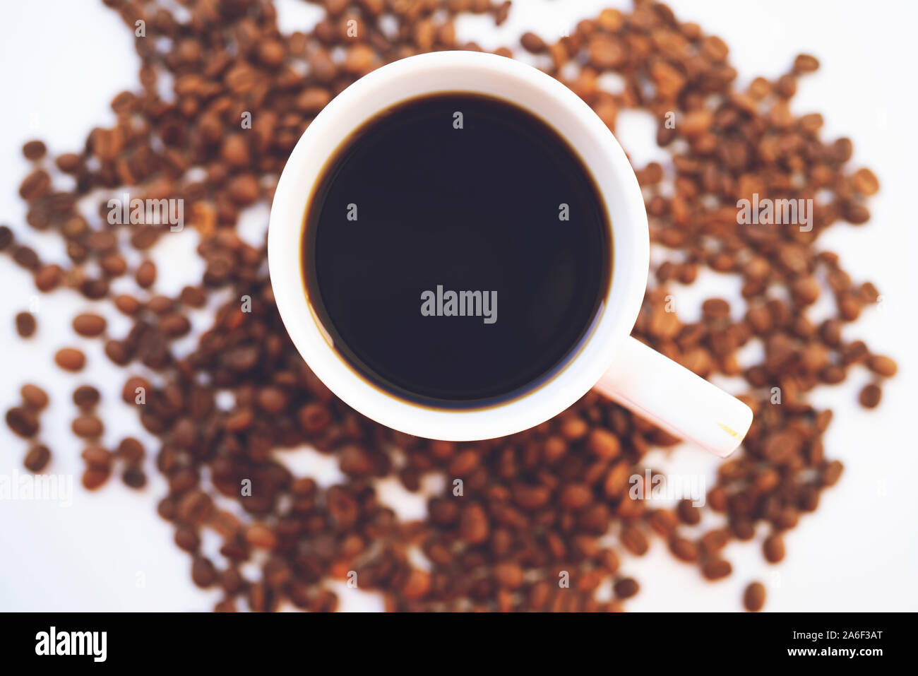 White coffee cup and coffee beans on white background Stock Photo - Alamy