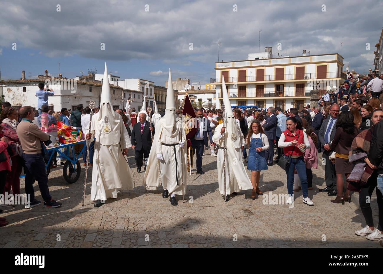 A religious brotherhood wearing penitential robes and conical hoods for a procession on Easter Sunday in Jerez de la Frontera, Andalusia, Spain. Stock Photo