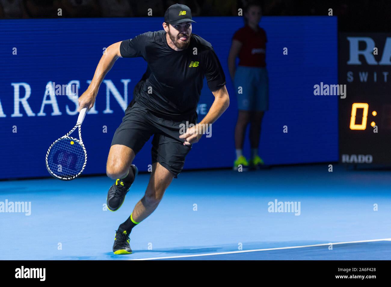 St. Jakobshalle, Basel, Switzerland. 26th Oct, 2019. ATP World Tour Tennis,  Swiss Indoors; Reilly Opelka (USA) chases the ball in the match against  Alex de Minaur (AUS) - Editorial Use Credit: Action