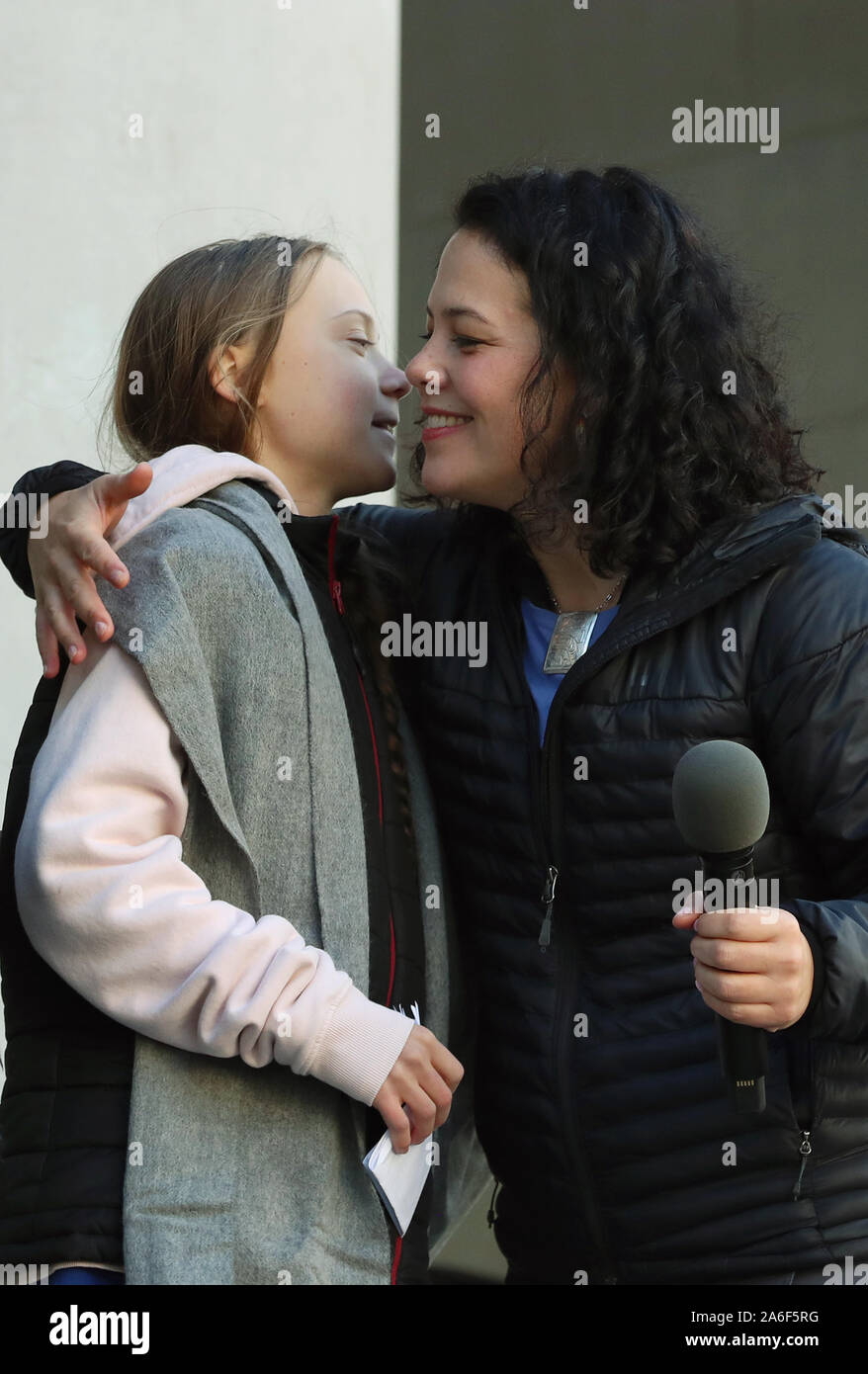 Vancouver, British Columbia, Canada, 25th October 2019. Swedish teen activist Greta Thunberg (L) receives a hug from Severn Cullis-Suzuki after arriving for the post federal election Friday climate strike march starting and ending at the Vancouver Art Gallery in Vancouver, British Columbia on Friday, October 25, 2019. Organized by local youth-led, Sustainabiliteens, Greta and a turn out of nearly 10,000 climate activists demand action from industry and the various levels of government and are supporting the 15-youth who announced their plans to sue the federal government alleging it has contri Stock Photo